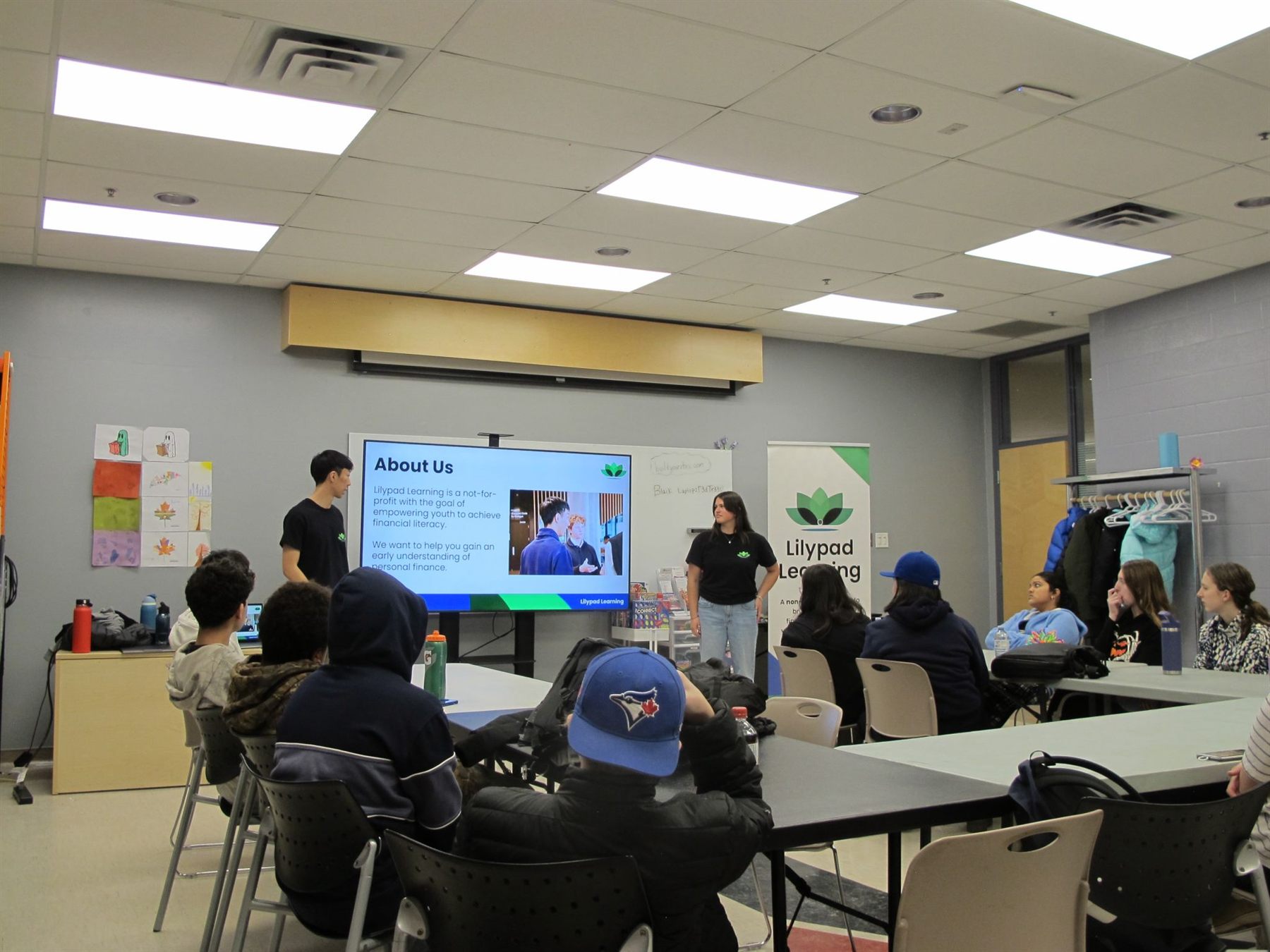 Educators introducing Lilypad Learning to a classroom of youth