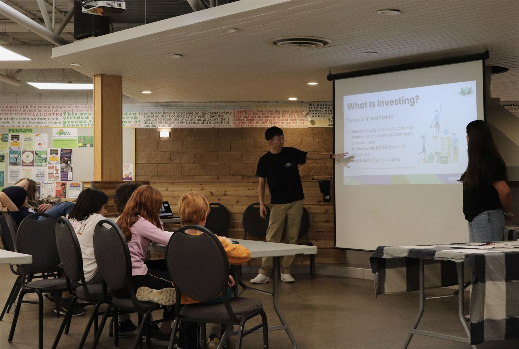 An educator presenting the investing module of Turn Your Cents Into Sense